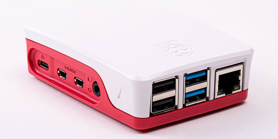 An image of a Raspberry Pi 4 in the official case. You can use Rasperry Pis to power digital signage